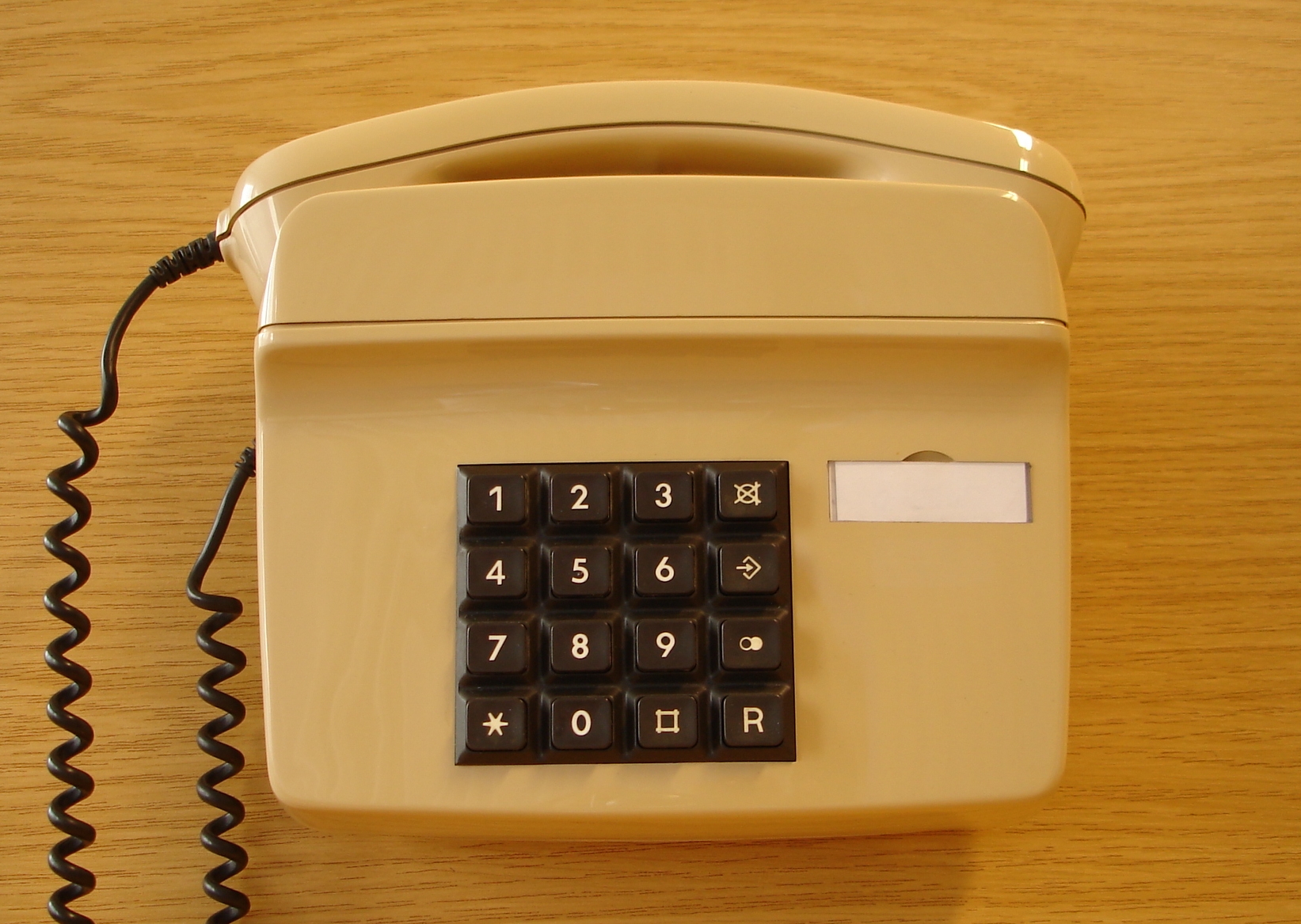 A beige and brown telephone.